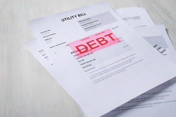 Fototapeta premium Debt inscription on utility bill, overdue payment notice with financial summary, household budget and expense report