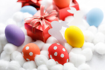 Happy Easter eggs and gift boxes on white background. Easter decoration.