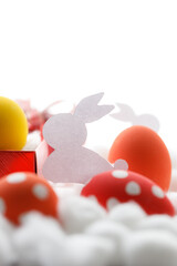 Happy Easter eggs and gift boxes on white background. Easter decoration.