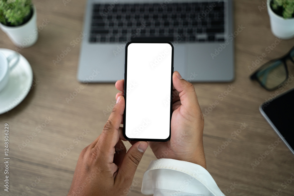 Poster top view mockup image hand using a smartphone man holding cell phone with blank screen