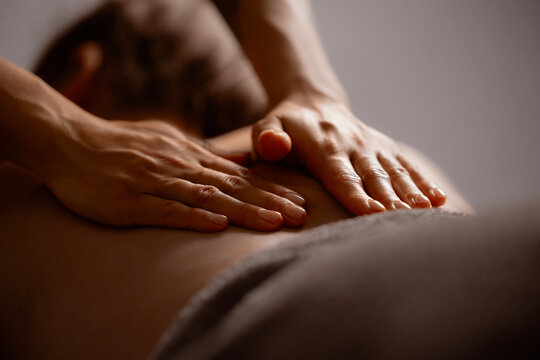 Relaxation massage for young women enhancing serenity and wellbeing, closeup of hand master
