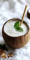 Fototapeta premium Tropical Coconut Drink with Mint Garnish for Refreshing Summer Vibes