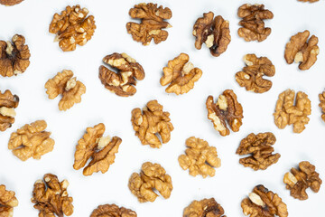 Walnut kernels, white background, top view.