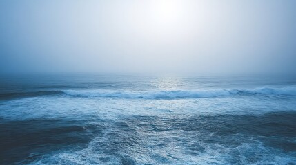Misty ocean waves crashing, sunlit horizon