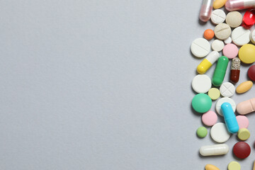 Various pills on gray background