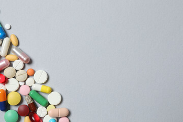 Various pills on gray background