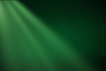 Green light rays on dark green background. Abstract green light background.