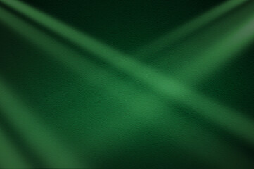 Green light rays on dark green background. Abstract green light background.