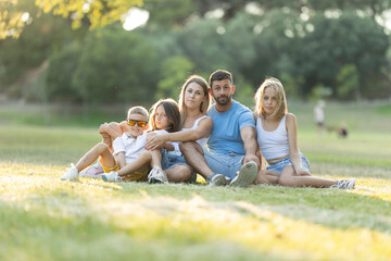 Fototapeta premium Family relaxing together on a sunny day outdoors