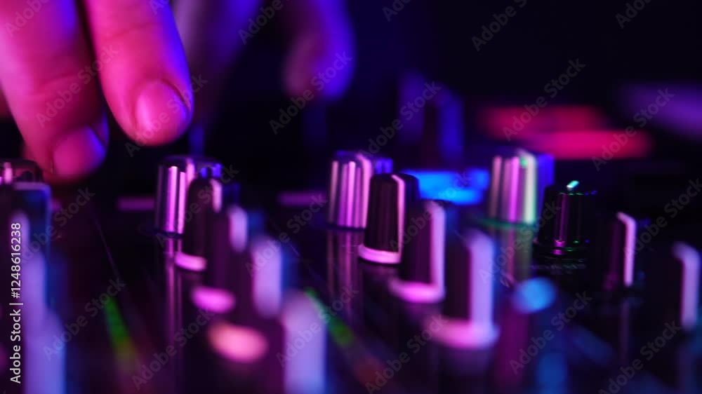 Poster dj playing music on controller, changing equalizer and gain on mixing console, close up