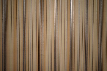Fototapeta premium Textured fabric with vertical stripes in warm neutral tones for interior design