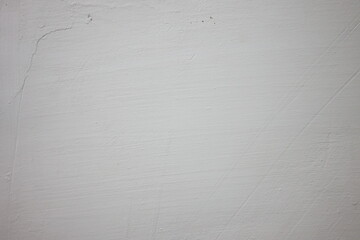 Close-up view of a textured white wall in a minimalistic space