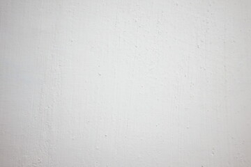 White textured wall with subtle details in natural lighting