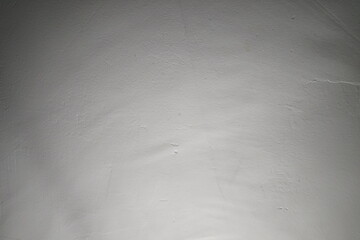 Surface texture with soft light highlighting features in a dim room