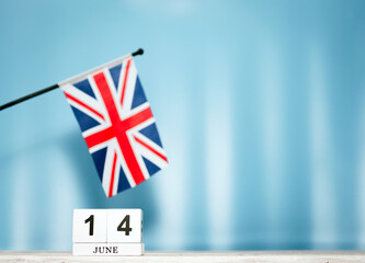 June Calendar With British Flag With Number  14. Calendar cubes with numbers. Space copy.