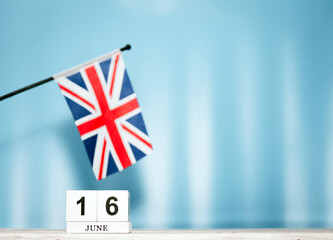 June Calendar With British Flag With Number  16. Calendar cubes with numbers. Space copy.