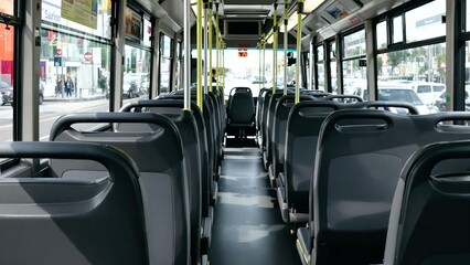 Obraz premium Empty Interior of Modern City Bus with Rows of Seats and Aisle