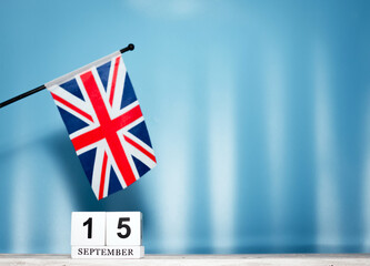 September Calendar With British Flag With Number  15. Calendar cubes with numbers. Space copy.