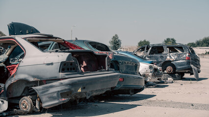destroyed and burned cars in the city in Ukraine