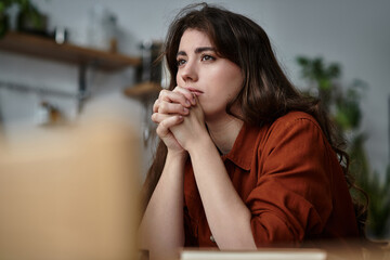 Exploring the depths of emotion as a woman confronts her thoughts in a calm environment