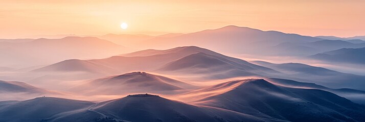 Obraz premium Majestic Sunrise Over Rolling Hills - A breathtaking view of rolling hills at sunrise, bathed in soft hues of orange and blue, evoking a sense of tranquility and natural beauty.
