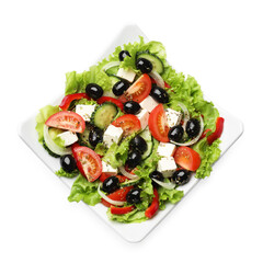 Delicious fresh Greek salad isolated on white, top view