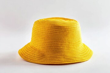 A single yellow hat sitting on a clean white surface, perfect for illustration or design