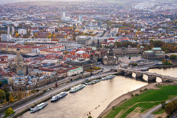 Fototapeta premium Stunning view of Dresden at sunset from hot air balloon. Charming cityscape with historic houses and winding Elbe River