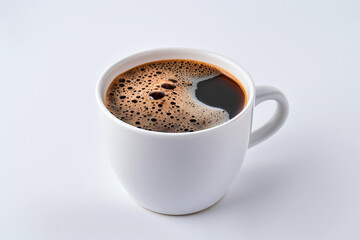 Fototapeta premium Classic white coffee cup with a dark espresso inside, positioned on a white background.