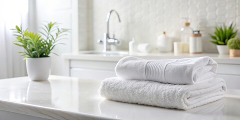 Soft white towel with gentle folds on a bathroom counter , absorbent, toiletries,  absorbent