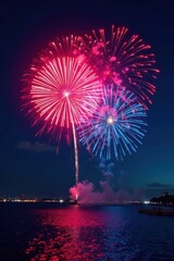 Fototapeta premium Crimson and blue fireworks illuminate the night, smoke, sky, elegant