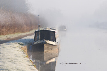 Narrow boat on a misty canal