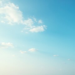 Obraz premium Pale blue sky with wispy clouds, gentle sun rays, subtle texture, calm, clear sky, airy