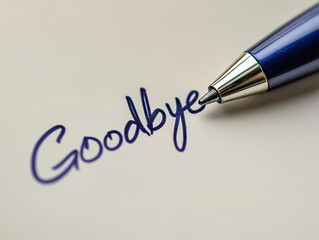 A pen is on a piece of paper with the word goodbye written in blue