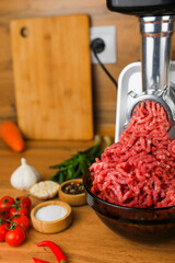 The concept of healthy eating, cooking. Side view on a wooden background: dark dishes with red...
