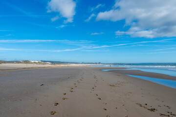 Wide Sandy Beach with Footprints