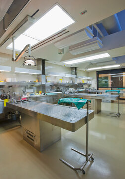Three autopsy tables at a morgue.