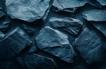 Fototapeta premium Monochromatic slate fragments composing an artistic stone wall surface texture evoking depth and a modern, natural aesthetic