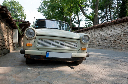 Old East German manufactured car, a Trabbi or Trabant, parked, low angle view of the front.