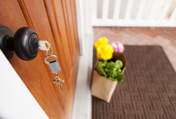 Close up of key in front door lock.