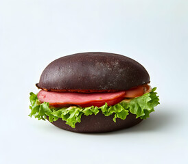 Artisanal dark bun burger with crisp lettuce, sliced tomato, and savory ham on a stark white background evoking modern culinary simplicity