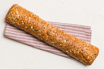 fresh crunchy french baguette on colored table. Top view Bakery products