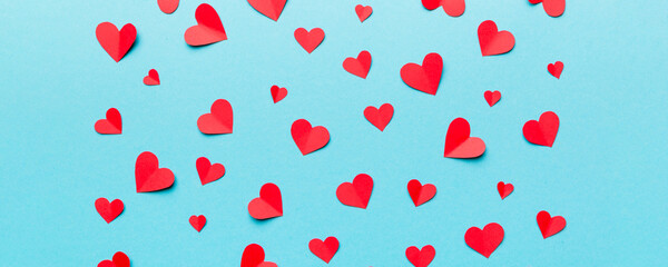 Valentine day background with red hearts, top view with copy space