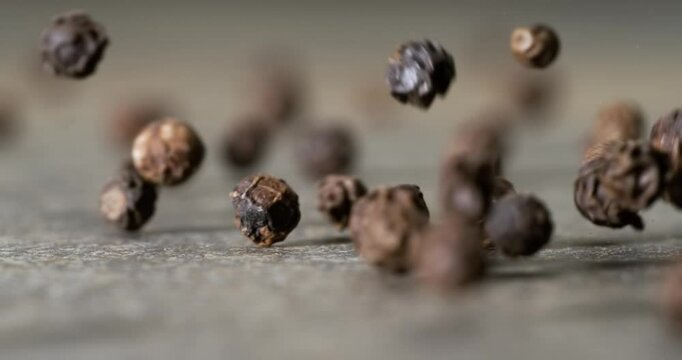 Peppercorns or black pepper spice. Super Macro Close Up. Shot on super slow motion camera 1000 fps.