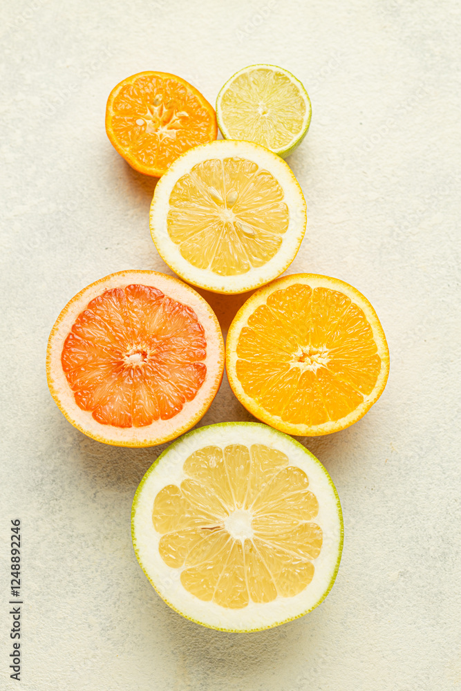 Aufkleber a row of oranges and limes are sliced and arranged on a white background. the oranges are in the mid