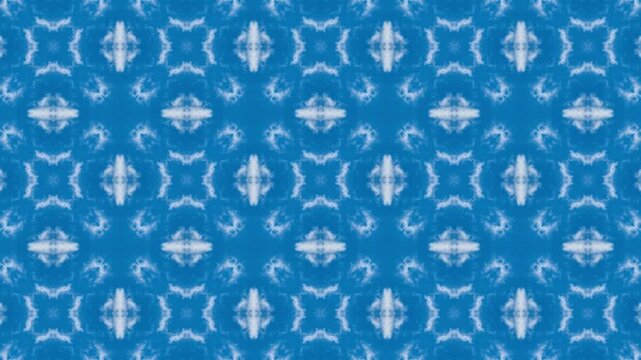 Blue and white patterned background with a blue and white design. The design is made up of squares