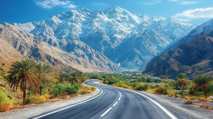 Fototapeta premium Majestic Mountain Road Trip: Scenic Highway Winding Through Palm Oasis