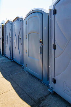 Row of portable restrooms at a reststop area on Route 90 in Washington state.