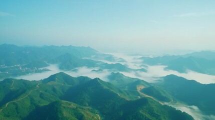 Misty mountain range sunrise aerial view, travel postcard