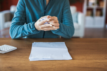 woman work from home and hold crumpled paper ball for the trash